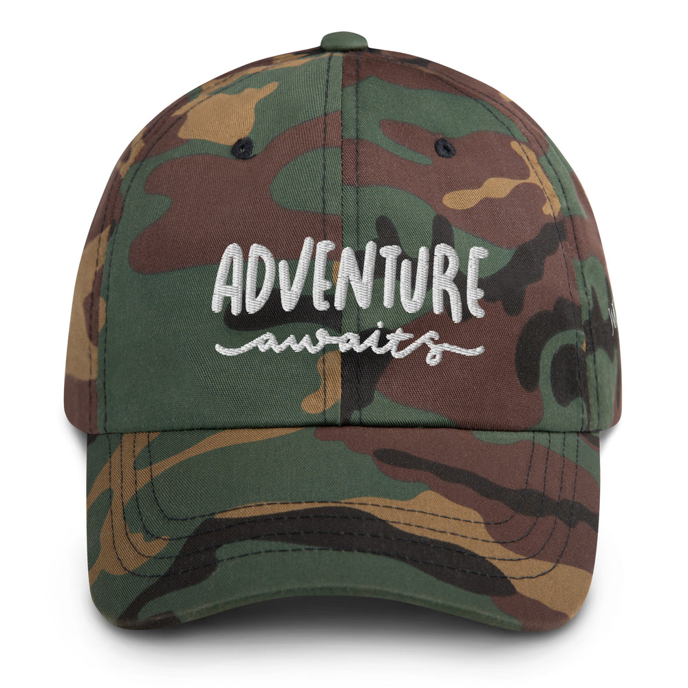 Looking to blend in during your next adventure, whether that be hunting or just going on a hike? Our classic camo cap might be the right accessory for you. This Yupoong cap comes with the words "Adventure Awaits" embroidered on the front.