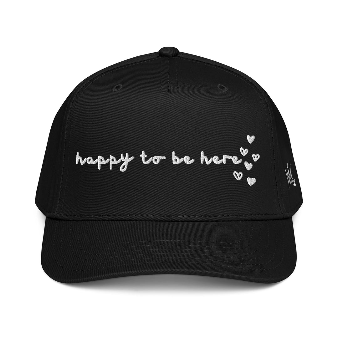 Five panel black Otto cap with the words Happy To Be Here embroidered in black font on the front of the cap