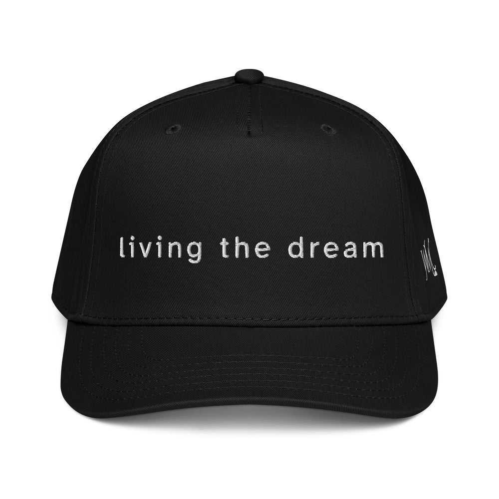 Black five panel Otto cap with the words living the dream embroidered on the front of the cap in white font.