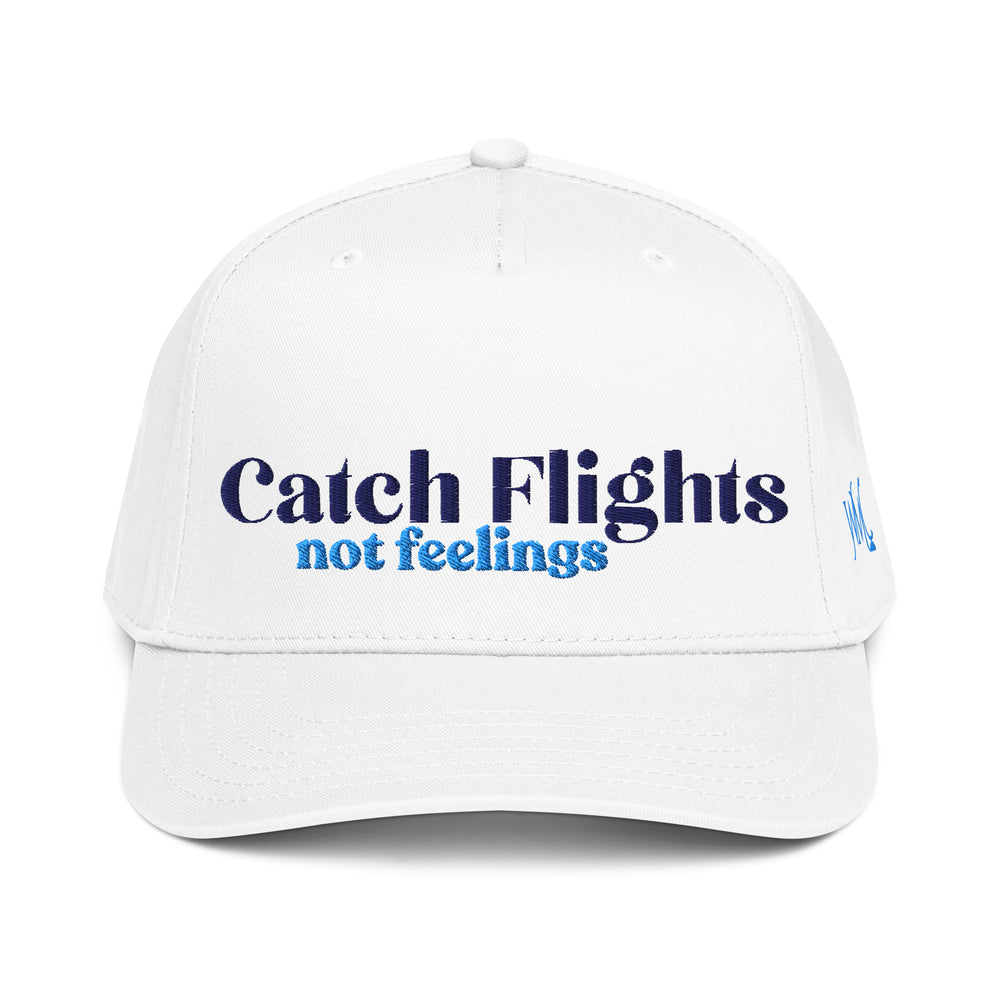 Five panel Otto cap with the words Catch Flights Not Feelings embroidered in dark and light blue font in the front. Some trips change your perspective. Others just confirm you’d rather fall in love with destinations than drama. The Catch Flights Not Feelings white cap is made for travelers who keep their passport close and their emotions… carry-on only.