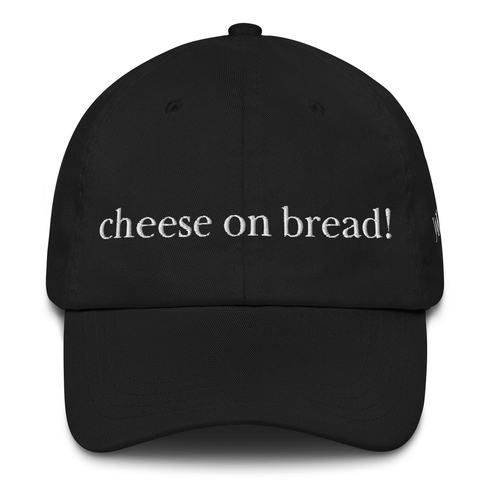 Black Yupoong classic dad cap with the words"cheese on bread!" embroidered on the front. This phrase is a popular local term in Barbados.