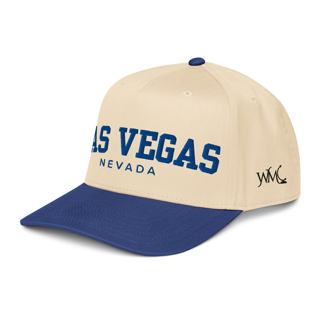 Five panel Otto cap with the words "LAS VEGAS NEVADA" embroidered in blue on the front. This cap features a blue bill and a beige crown.