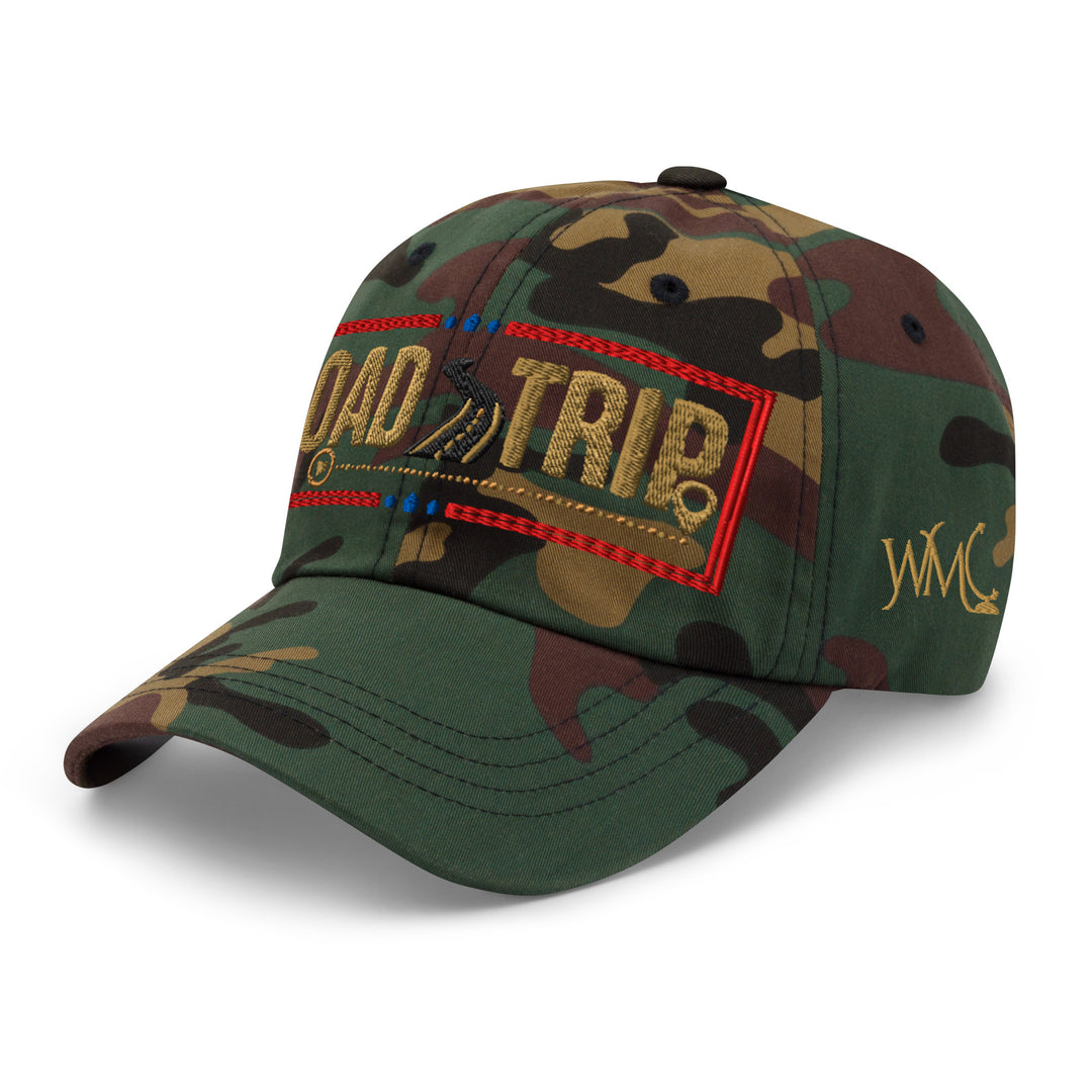 Classic cap camo style with the words Road Trip embroidered on the front in gold font. The words Road and Trip are separated by the image of a road, with a red border around the overall design.