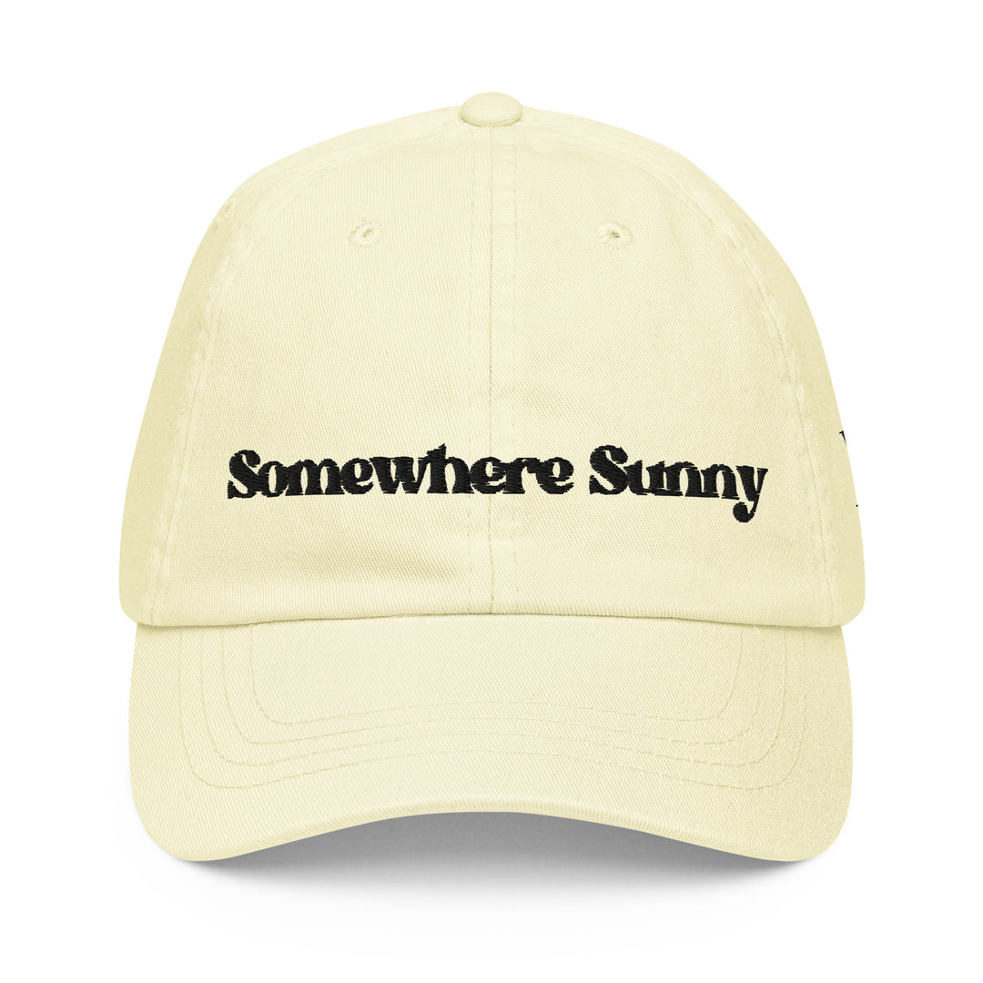 Paste lemon cap with the words Somewhere Sunny embroidered across the front in black font. This pastel lemon colored cap is a great addition to your Travel Fit wardrobe.