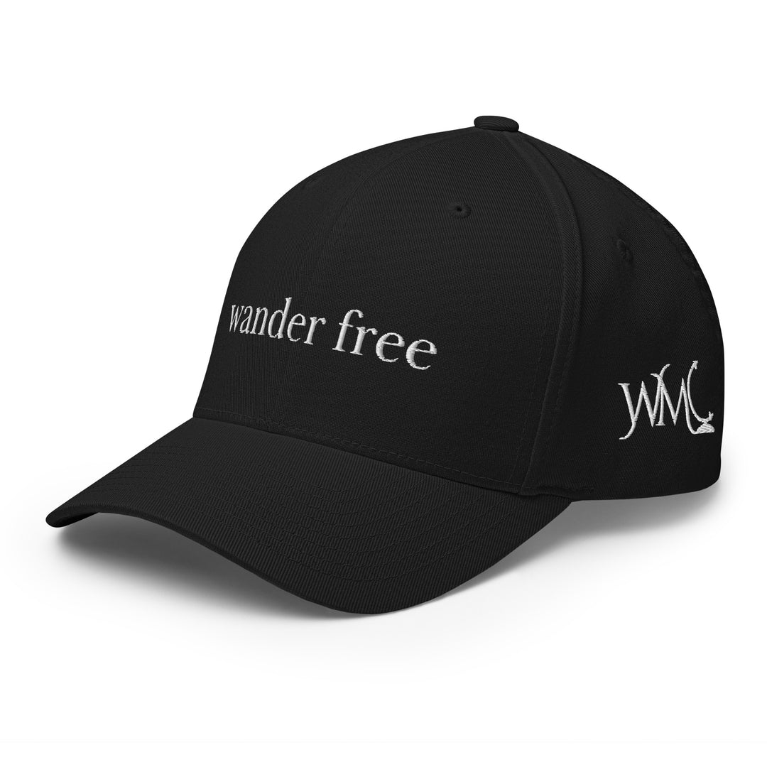 Classic Flexfit Yupoong black cap with the words "Wander Free" embroidered in white font at the front of the cap.