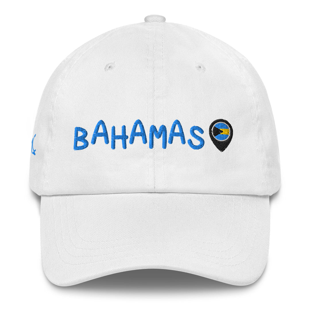 This white classic cap features BAHAMAS elegantly embroidered in light blue font across the front, paired with a location icon showcasing the vibrant colors of the Bahamian flag.