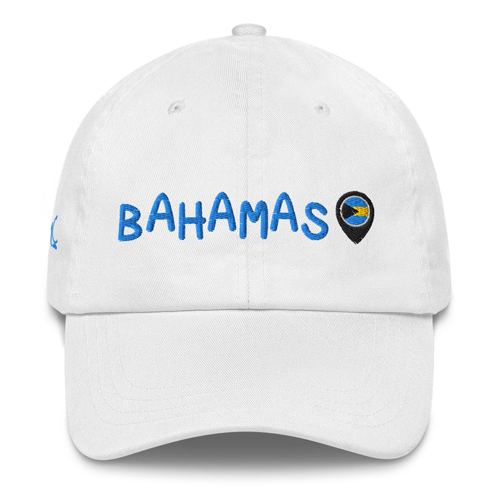This white classic cap features BAHAMAS elegantly embroidered in light blue font across the front, paired with a location icon showcasing the vibrant colors of the Bahamian flag.