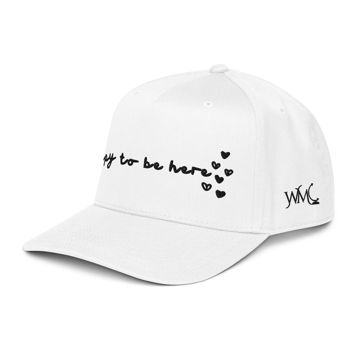 Five panel white Otto cap with the words Happy To Be Here embroidered in black font on the front of the cap.