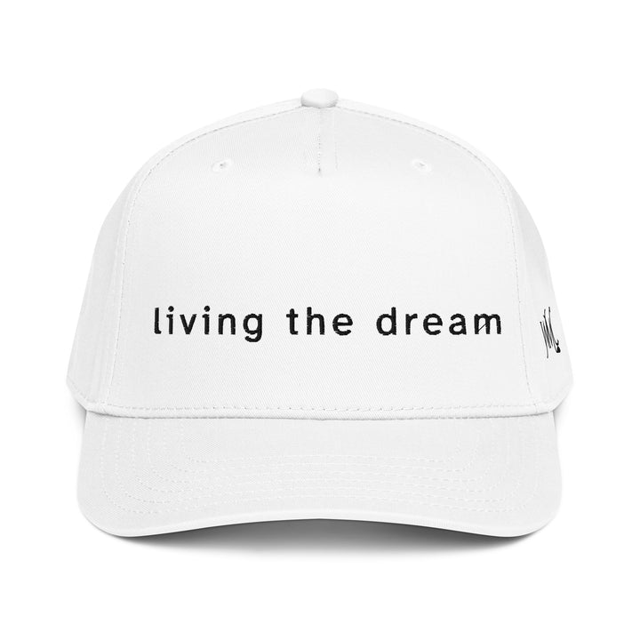White five panel Otto cap with the words living the dream embroidered in black on the front of the cap in black colored font.
