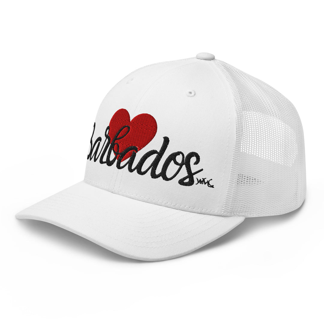 White Yupoong trucker hat with a red heart sitting on top of the word "Barbados." Show your love for Barbados and the Caribbean. Perfect gift for vacation goers.